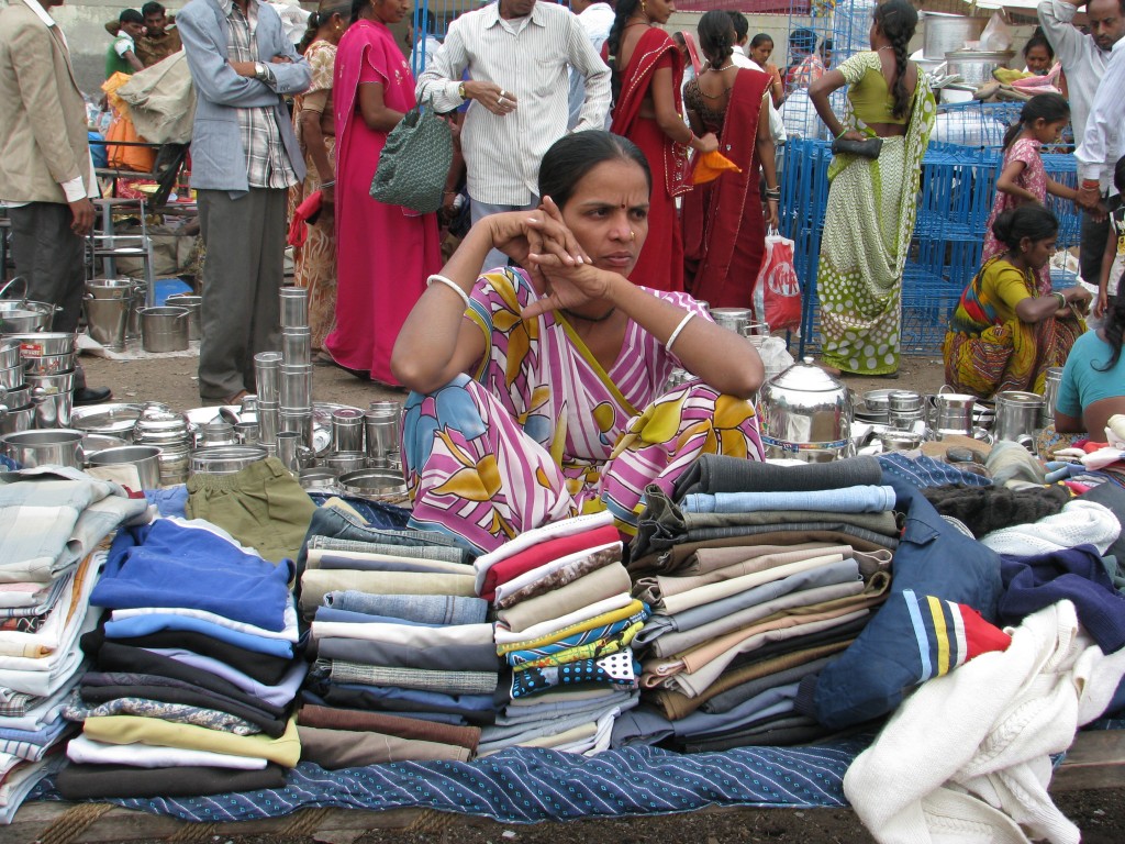 Woman Trading Clothes at the Gujari Bazaar Woman Trading Clothes at the Gujari Bazaar